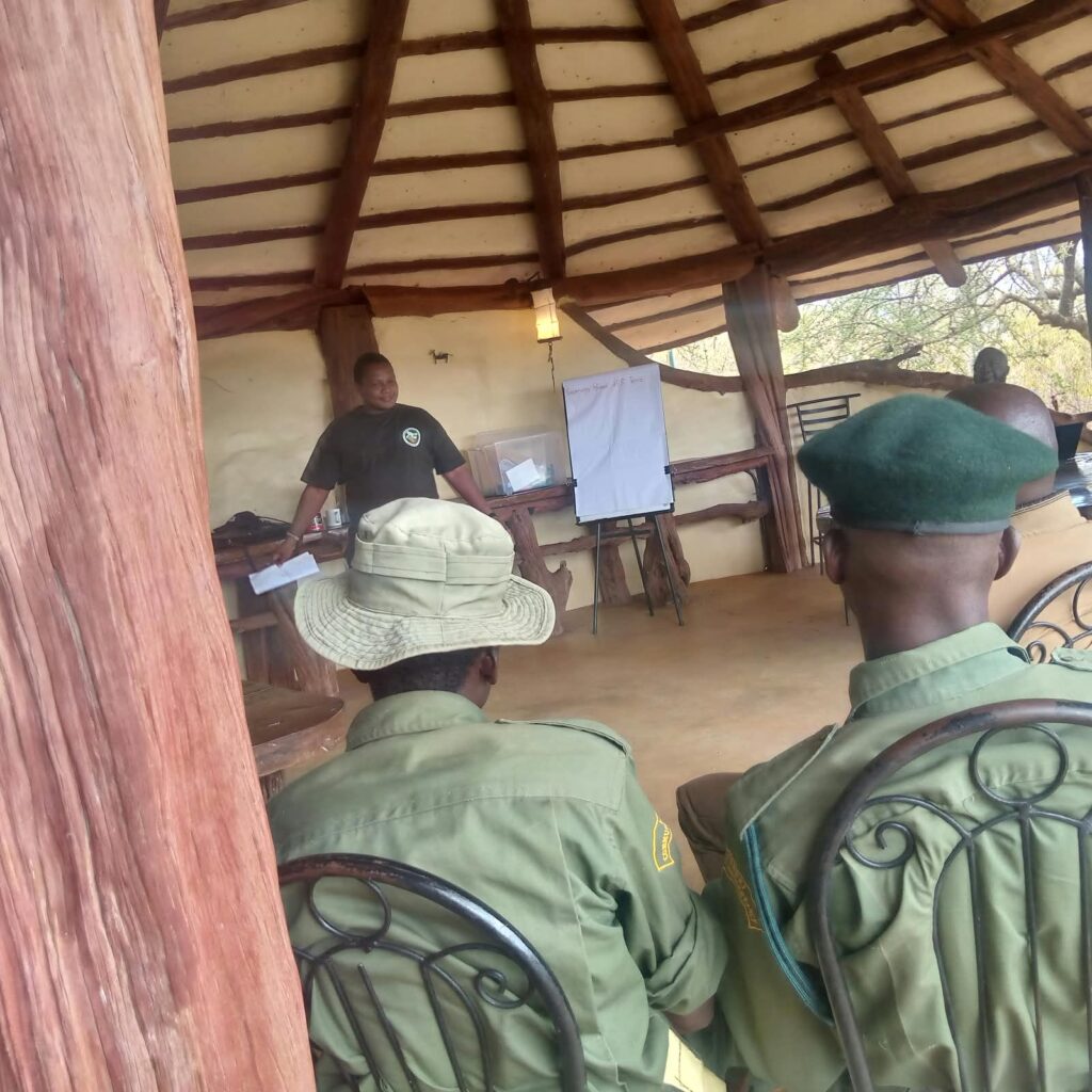 Facilitator leading the conservancy ranger SOP refresher session at Tassia Lodge