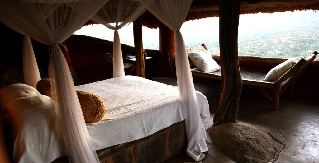 Bedroom with open views across the valley at Tassia Lodge