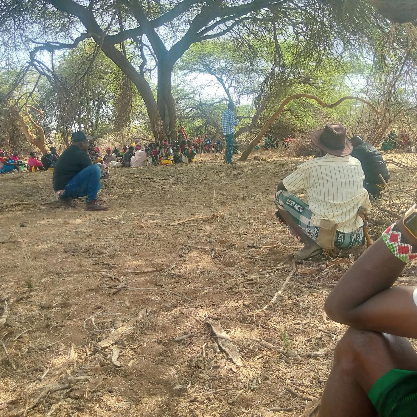 Community members and conservancy staff at a briefing before restoration work at Tenge Block